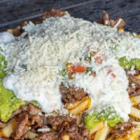 Carne Asada Fries · Served with cheese, salsa, guacamole, and sour cream.