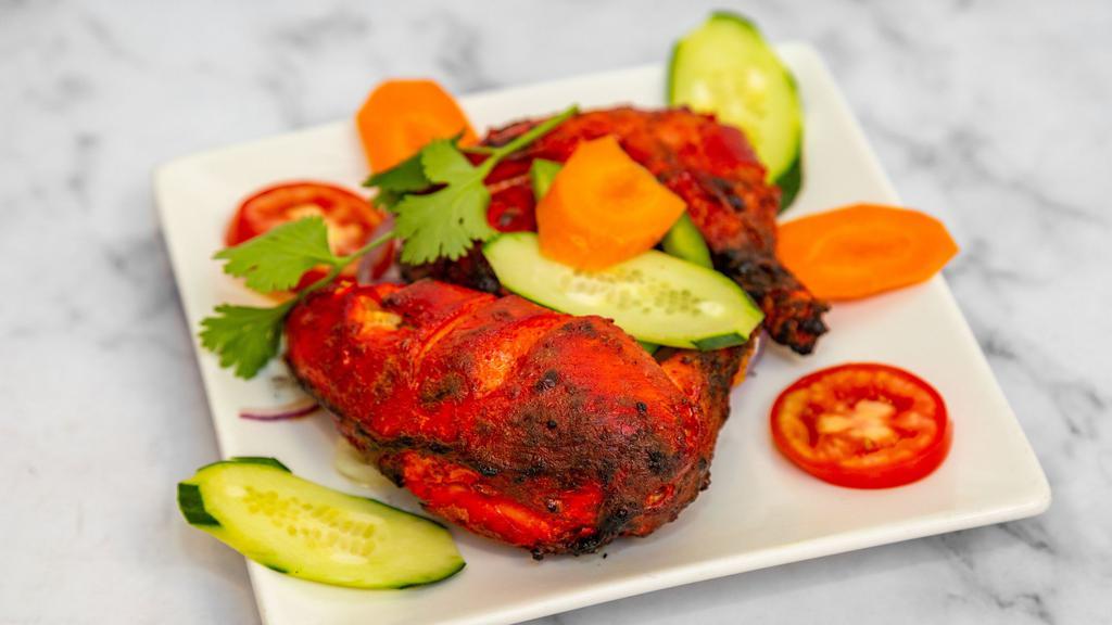 Tandoori Chicken · Grilled chicken marinated in yogurt and spices.