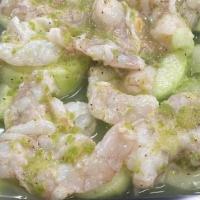 Green Aguachile · Shrimp cooked in lime juice, green spicy house sauce, onion, cucumber, and avocado on top.