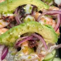 Aguachile Mixta Verde · Shrimp cooked in lime juice, cooked shrimp, octopus mixed with green sauce, onion, cucumber ...