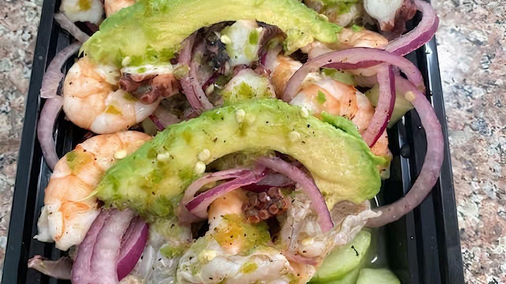 Aguachile Mixta Verde · Shrimp cooked in lime juice, cooked shrimp, octopus mixed with green sauce, onion, cucumber and avocado on top.