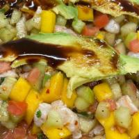 Ceviche Tropical Curtido  · Shrimp cooked in lime juice, tomato, chunks of mango, small pieces of serrano chile, onion, ...