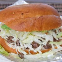 Tortas · Meat of choice, beans, jalapeño, tomatoes, onions,cream,lettuce, cheese and avocado.
