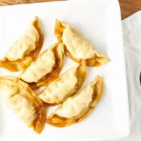 Chicken Pot Stickers · Cabbage, garlic, peppers, ginger and sweet soy vinaigrette.