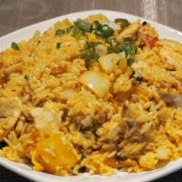 Pineapple Fried Rice · Comes with pea, carrot, white onion, and raisin saute with eggs and steamed rice.
