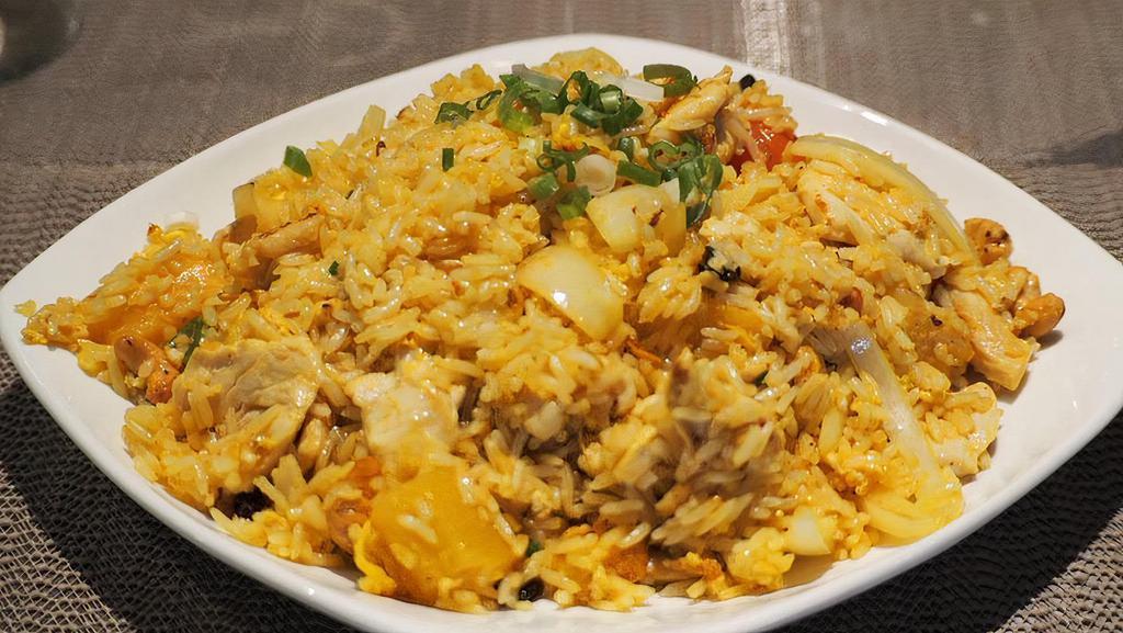 Pineapple Fried Rice · Comes with pea, carrot, white onion, and raisin saute with eggs and steamed rice.