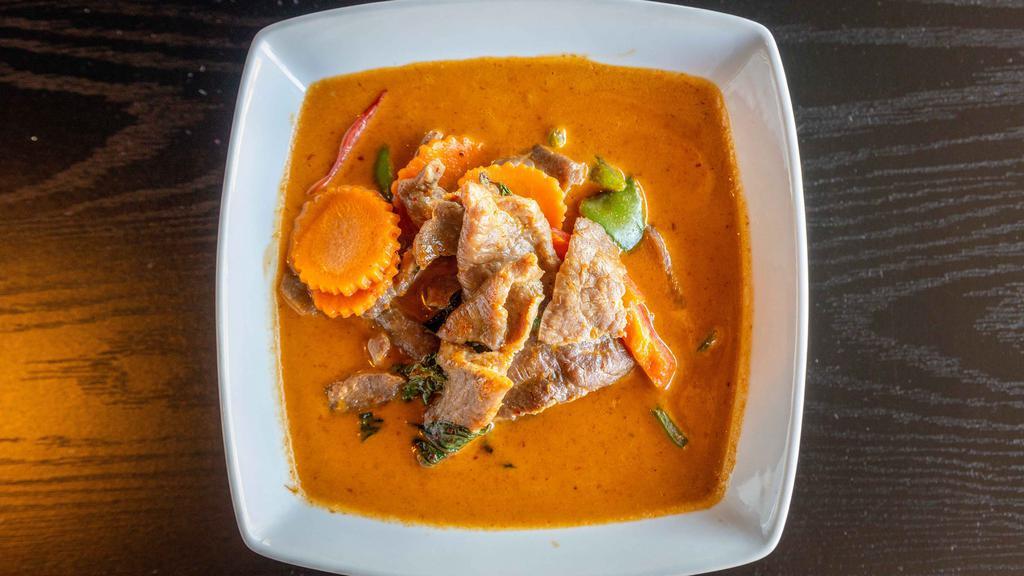 Panang Curry · Comes with bell pepper, carrot, and basil leaves.