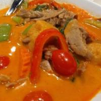 Siam Neramid · Special curry with grill duck, comes with baby tomato pineapple, bell peppers, carrot, and b...
