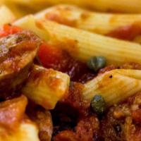 Penne Siracusa · Italian sausage with peas, mushrooms, black olives, garlic and tomato sauce.