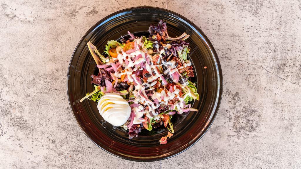 Chopped · Gluten-free. Local Mixed Greens, Hard-Boiled Egg, Bacon, Heirloom Cherry Tomatoes, Bleu Cheese, Pickled Red Onions, Black Beans, Ranch Dressing.