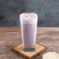 Trà Sữa Khoai Môn - Iced Taro Milktea · Daily-made taro tea brewed with pandan leaves; served with non-dairy coconut creamer.