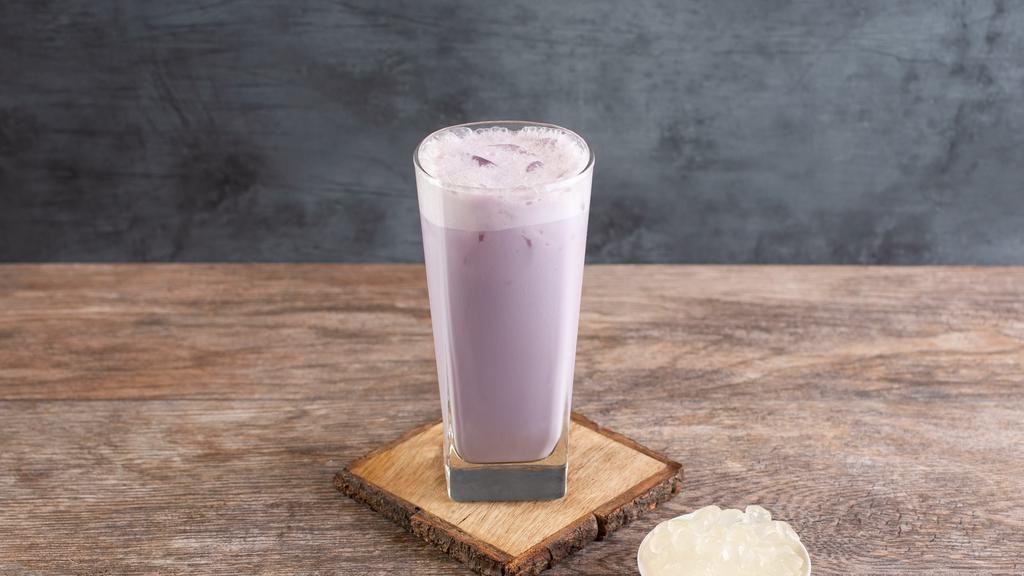 Trà Sữa Khoai Môn - Iced Taro Milktea · Daily-made taro tea brewed with pandan leaves; served with non-dairy coconut creamer.