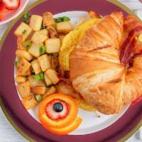 Croissant Eggs Sandwich · 2 eggs, Bacon, cheddar cheese and mayo.