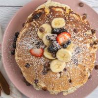 Chocochip Pancakes · 3 chocolate chip  pancakes with Strawberry, banana, blueberry, and powder sugar.
