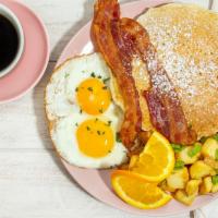 American Breakfast · 2 eggs, 2 mini pancakes, bacon, choose of breakfast potatoes or fruit.
