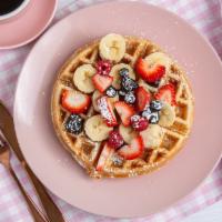 Waffles · With Strawberry, banana, blueberry, powder sugar.