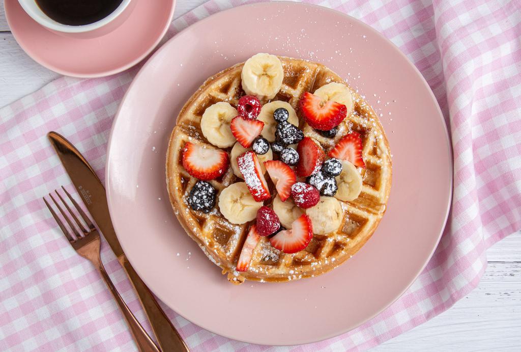 Waffles · With Strawberry, banana, blueberry, powder sugar.