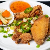 Chicken Wings/Cánh Gà Chiê · Fried chicken wings with sea salt pepper and green onion.