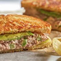 Tuna Sandwich · Tuna in a long bread with lettuce, tomato, pickles, cucumber and onions.