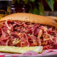 Pastrami Sandwich · Pastrami in a long bread with lettuce, tomato, pickles, onions and cheese.