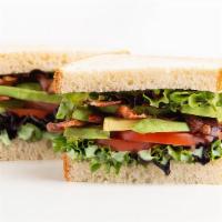 Avocado Blt Sandwich · Crispy bacon, lettuce, tomato, sliced avocado, and pesto spread. Served on your choice of wh...