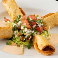 Flautas · Four egg roll size fried flour tortillas filled with shredded chicken and red sauce. A great...