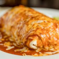 Machaca & Egg Burrito · Shredded beef, scrambled eggs, tomato, onion and cilantro.  Served wet with red sauce, melte...