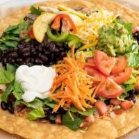 Tostada Salad · Organic greens, grilled vegetables, organic rice, organic beans, cheese, cabbage, carrots, t...
