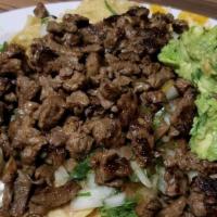 Carne Asada · Steak on the grill. se sirve con arroz y frijoles. served with rice and beans.