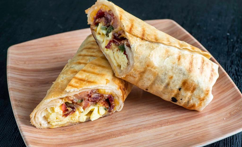 Breakfast Burrito · Includes eggs, cheese & pico de gallo wrapped into a grilled flour tortilla