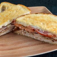 Turkey Melt With Bacon · Grilled Turkey topped with Thick Cut Bacon,  melted Monterey Jack, Tomatoes & Mayo on Grille...