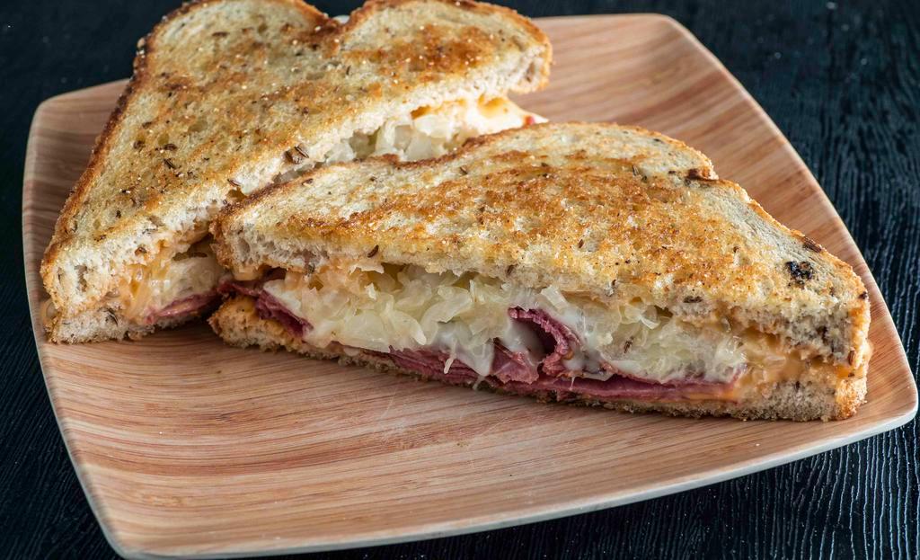 Ruben · Grilled pastrami, grilled rye, melted swiss cheese topped with kraut. Your choice of thousand island or spicy mustard.
