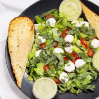 Caprese Salad (Full) · Romaine, baby balls of fresh milk mozzarella, & cherry tomatoes with basil vinaigrette with ...