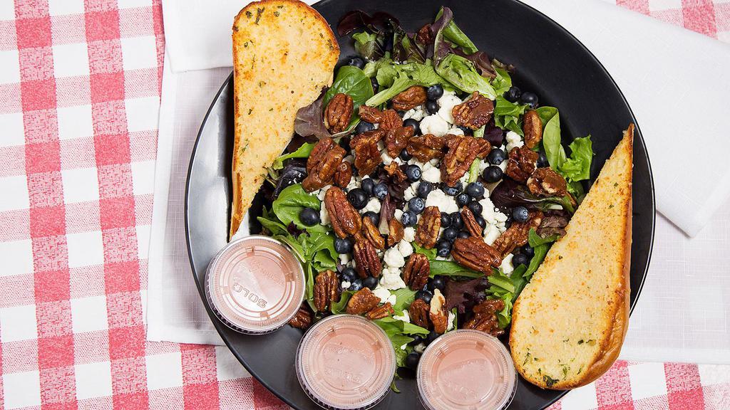 Baby Greens Salad (Full) · Spring mix, candied pecan, gorgonzola & seasonal fresh berries with raspberry walnut dressing with garlic bread.  Add chicken for a cost.