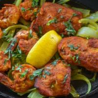Fish & Shrimp Tandoori (A La Carte) · Combination of fish and shrimp, marinated in spices and baked in a clay oven and served with...
