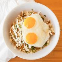 Chilaquiles · Egg, cheese, onion mix, sour cream, and avocados.