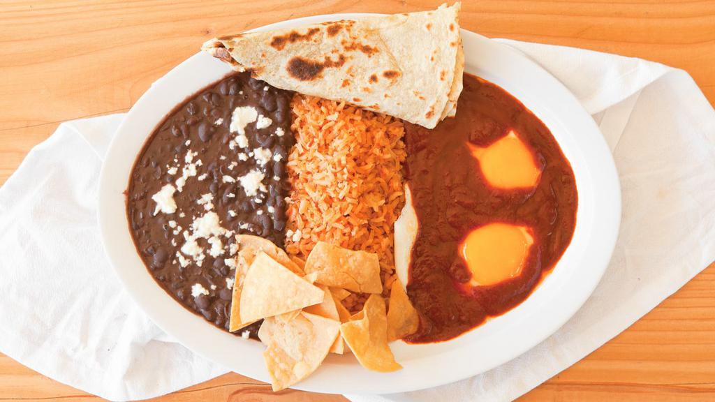Huevos Ranchero · Rice, black beans, eggs any style, red or green salsa, flour or corn tortilla.
