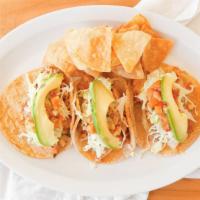 Fish Tacos Trio · Cabbage, cilantro cream, pineapple sauce, avocado, lime.