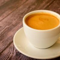 Cafe Americano · Equal parts rich, dark espresso and hot water.