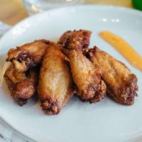 Hunan Chicken Wings (6) · Spicy. Crispy chicken wings glazed in a spicy, homemade sauce.