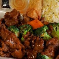 Beef Broccoli · Sliced beef stir fried with fresh broccoli in flavorful brown sauce. Served with steamed rice.