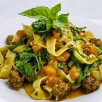 Pappardelle Alla Domenica · Pappardelle with mild Italian sausage sauteed with garlic, tomatoes, spinach and olive oil.