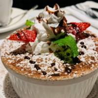 Tiramisu · The classic Italian dessert.  A layers of mascarpone cream set atop ladyfingers soaked in es...