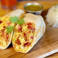 Baja Breakfast Burrito · Crispy applewood smoked bacon or crumbled chorizo, butter browned tater tots, queso blanco a...