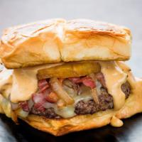 Cheesy Hawaiian Burger · Grilled pineapple, applewood smoked bacon, queso sauce, pepper jack cheese, caramelized onio...