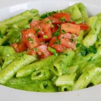 Penne Alla Genovese · Basil-walnut pesto with a garlic wine cream sauce topped with marinated tomatoes.