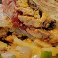 Breakfast Burrito · Large tortilla stuffed with eggs, salsa, jalapeños, cheese, and your choice of ham, bacon, o...