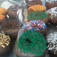 Chocolate Cake Donut · Plain, chocolate icing, sprinkles, coconut, peanuts, fruity pebbles.