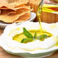 Labneh · Mediterranean cream cheese with garlic and fresh mint. Served with tomato slices and black o...
