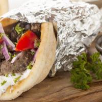 Jumbo Beef Shawarma Sandwich (Gyro) · Slices of beef, lettuce, tomatoes, onions, pickles, hummus and tahini sauce.